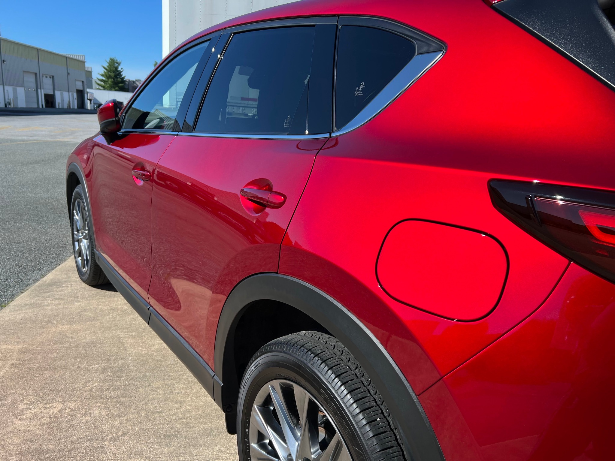 Red Mazda SUV trim and plastic detail